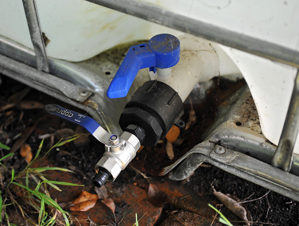 The large blue plastic tap at the top of the photo comes with the IBC tank but is only very basic. The black fittings under that are thread adapters. The first, and largest, adapter is the hardest to find.